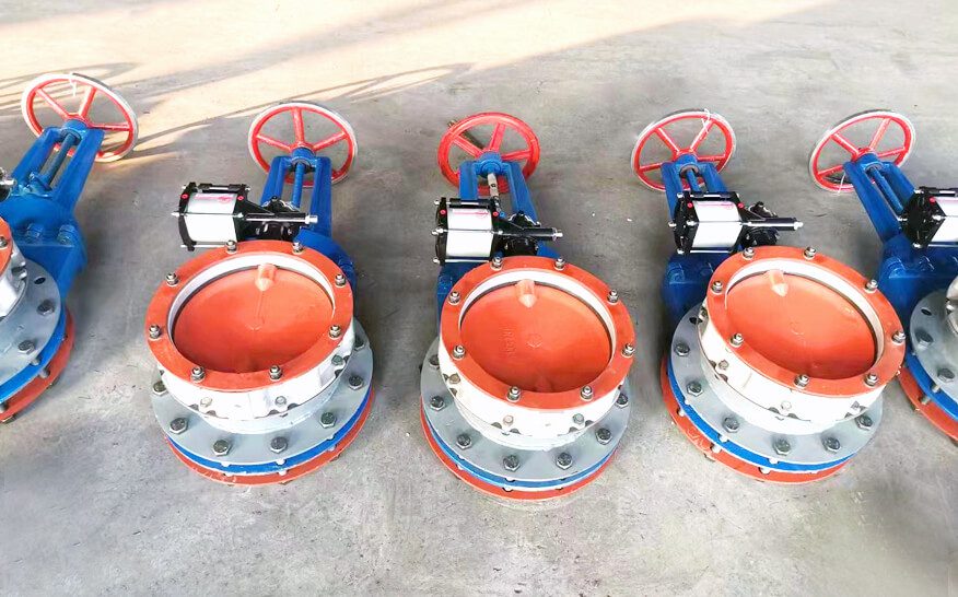 A set of three pneumatic butterfly valves featuring red and blue handles, showcasing their distinct operational controls.