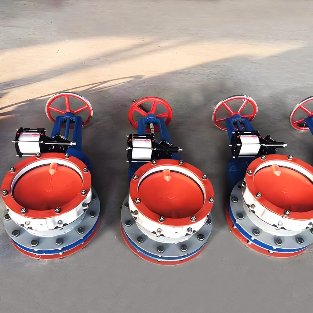 A set of three pneumatic butterfly valves featuring red and blue handles, showcasing their distinct operational controls.