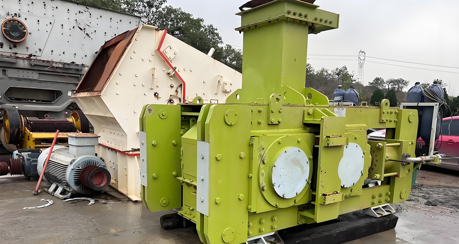 High-efficiency roller press used in cement production for material compaction and grinding.