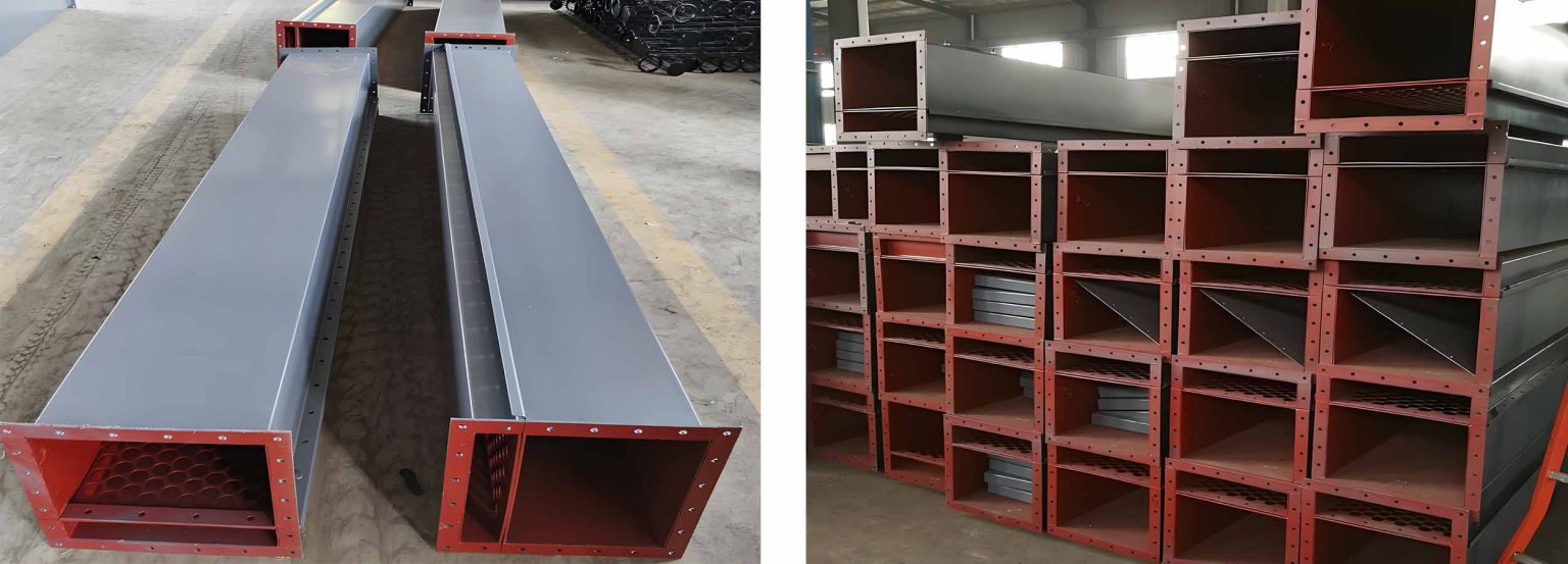 Several large metal boxes are stacked together to demonstrate the structure and function of the air slide conveyor