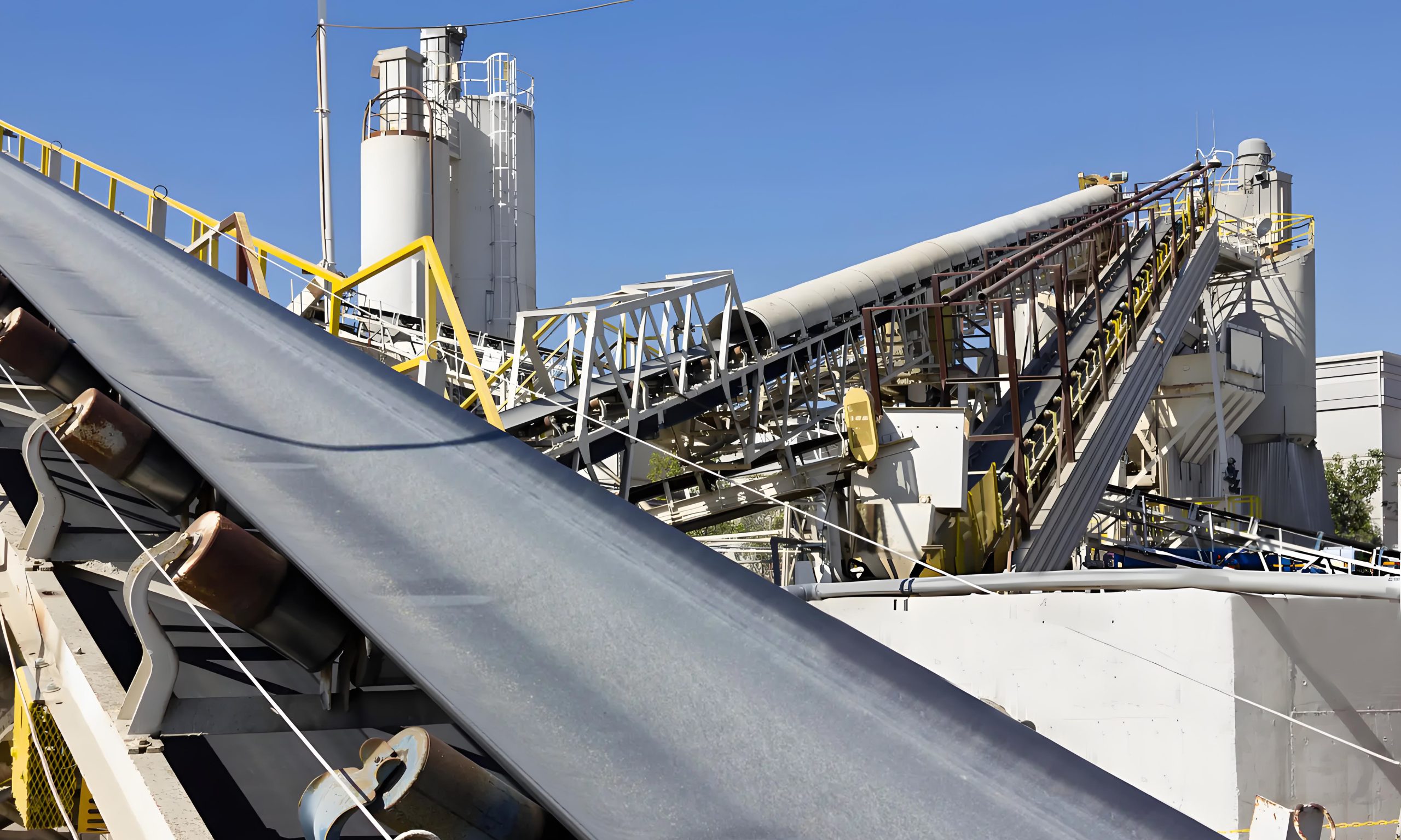 A conveyor belt is moving downwards, demonstrating the efficient process of material transportation