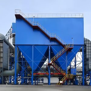 In a large industrial plant, a prominent blue dust collector stands out in the foreground, efficiently managing dust amid the machinery.