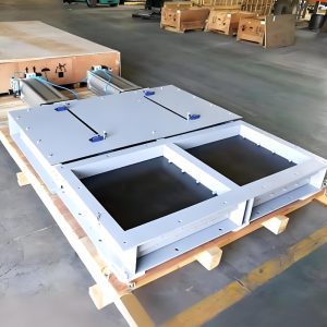 Inside the factory, a double-door pneumatic gate valve sits on a pallet, ready for installation in material handling systems.