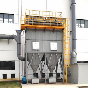 Outside a white factory, a large ATEX dust collector stands, designed for safe and efficient dust management in hazardous environments.