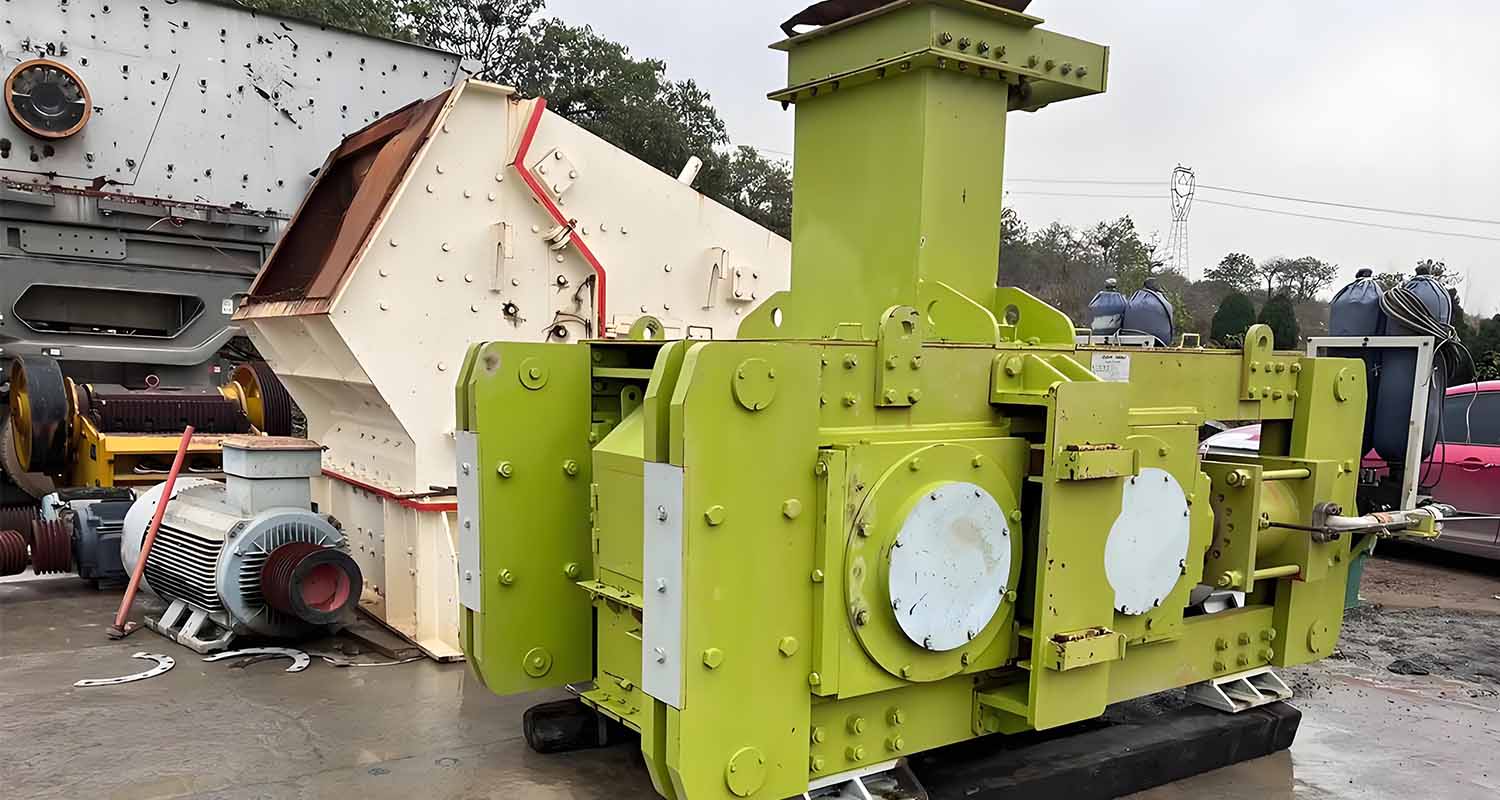 High-efficiency roller press used in cement production for material compaction and grinding.