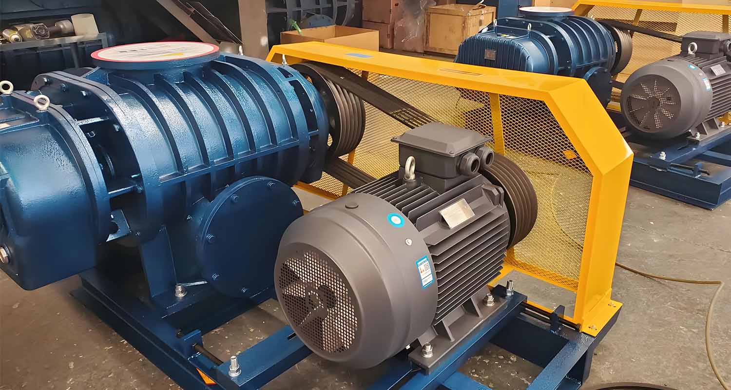 Large blue and yellow industrial fans, type Roots blowers, showing their importance and efficiency in industrial applications.